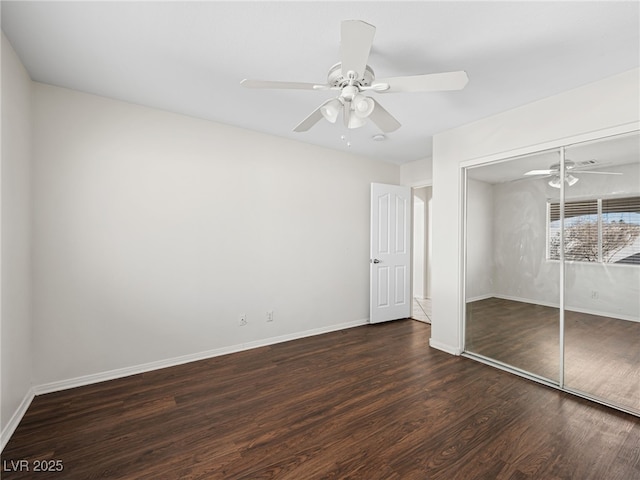 unfurnished bedroom with a closet, ceiling fan, and dark wood-type flooring