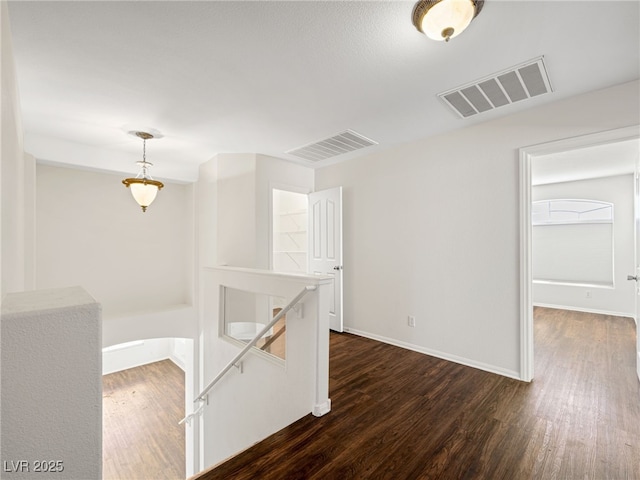 interior space with dark hardwood / wood-style flooring