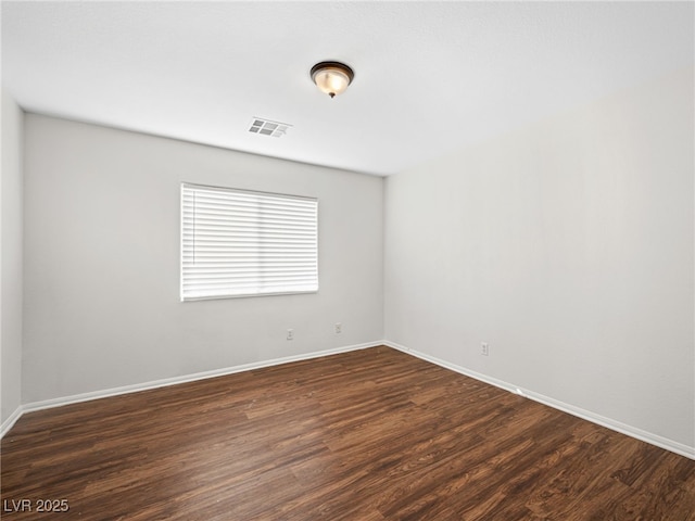 unfurnished room featuring dark hardwood / wood-style floors