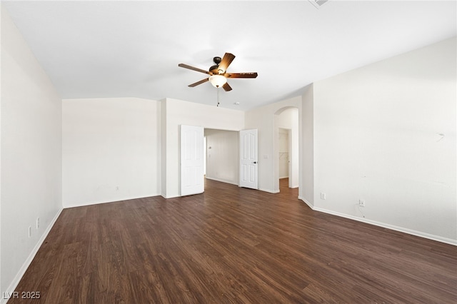 spare room featuring dark hardwood / wood-style flooring and ceiling fan