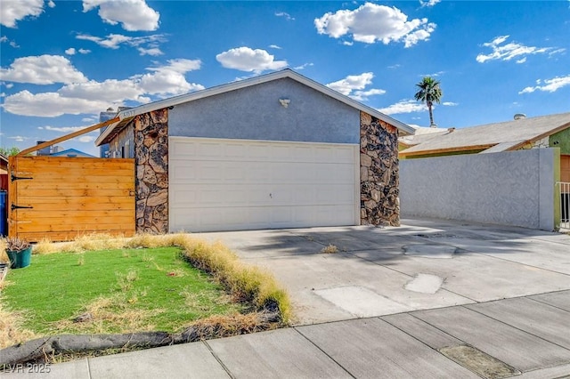 view of side of home with a garage