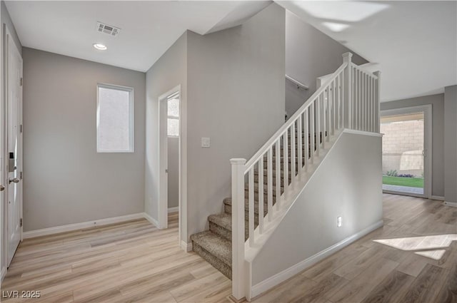 entryway with light hardwood / wood-style floors