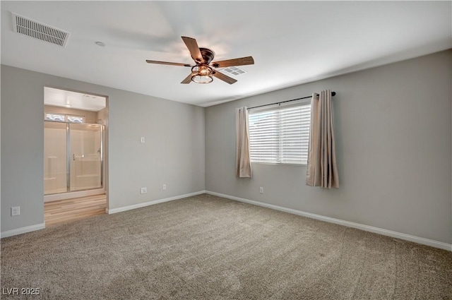 unfurnished room with ceiling fan and carpet flooring