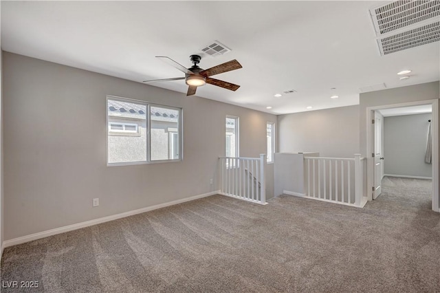 carpeted empty room with ceiling fan