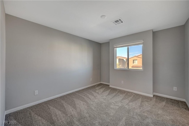 unfurnished room featuring carpet