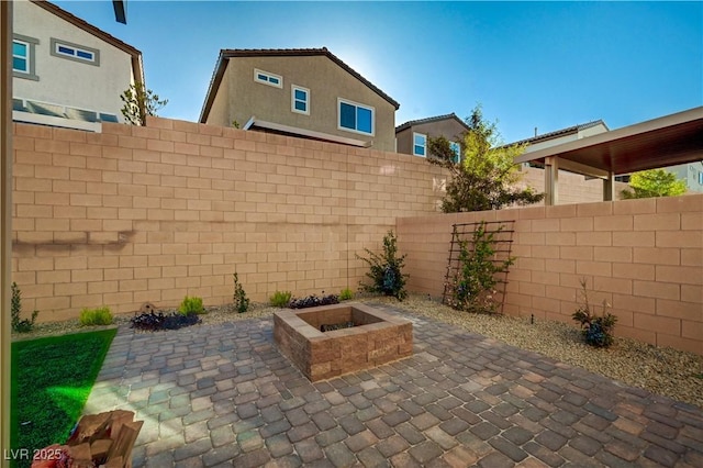 view of patio / terrace featuring an outdoor fire pit