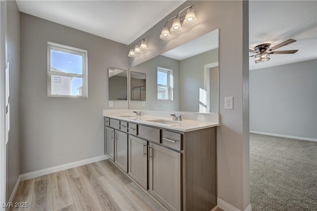 bathroom with vanity, wood-type flooring, and ceiling fan