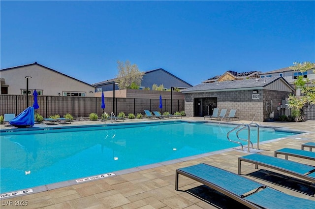 view of swimming pool featuring a patio area