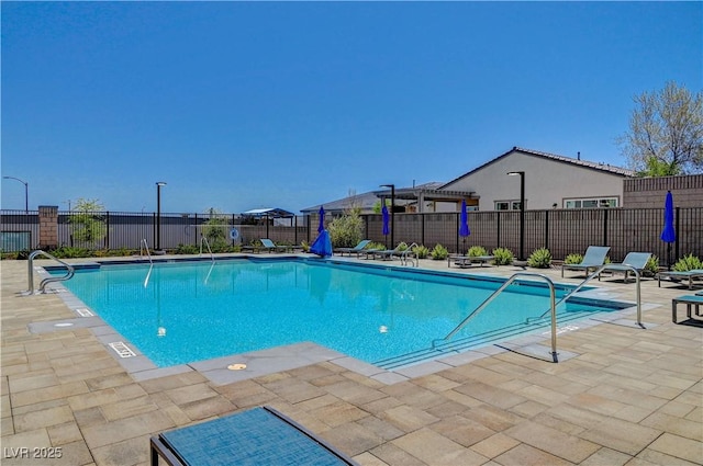 view of pool with a pergola and a patio area