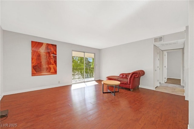 sitting room featuring wood-type flooring