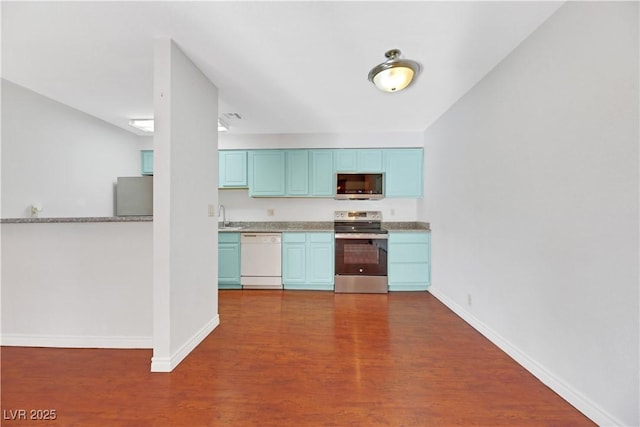 kitchen featuring dark hardwood / wood-style flooring, sink, and stainless steel appliances