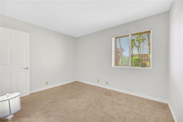 unfurnished room with light carpet