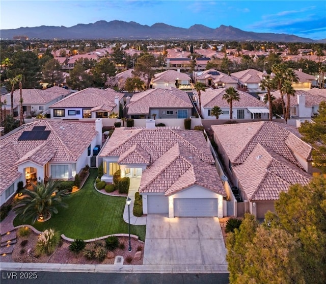 birds eye view of property featuring a mountain view