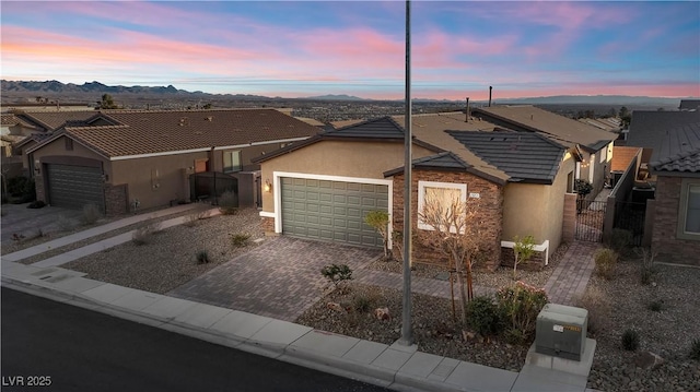 ranch-style house featuring a mountain view and a garage