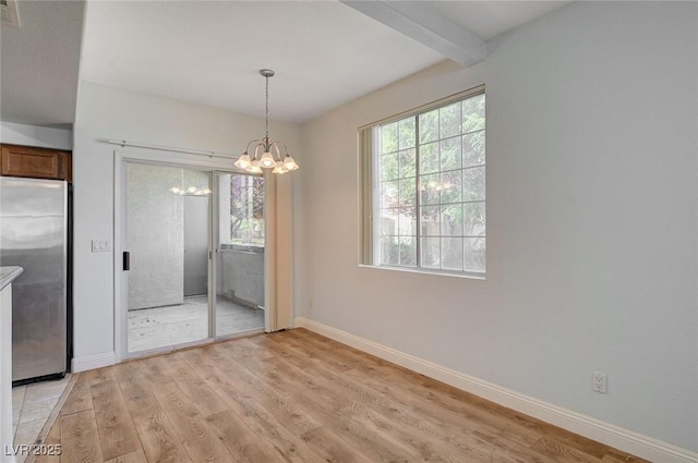 1701 King James St Unit 101, Las Vegas, NV 89144 - unfurnished dining area featuring light wood-style flooring, a chandelier, plenty of natural light, baseboards, and beamed ceiling