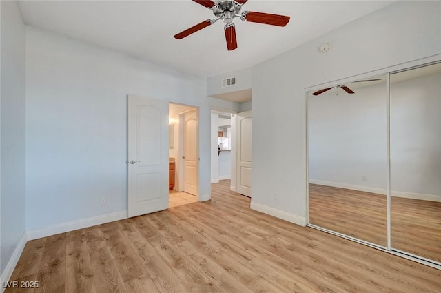 1701 King James St Unit 101, Las Vegas, NV 89144 - unfurnished bedroom with light wood-style flooring, a closet, baseboards, and a ceiling fan