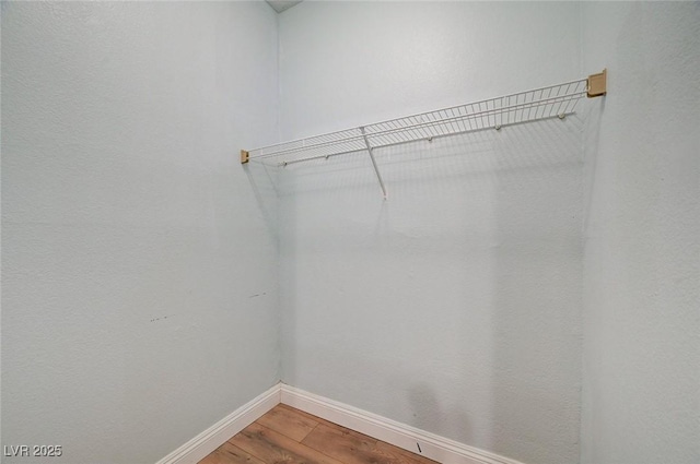 1701 King James St Unit 101, Las Vegas, NV 89144 - walk in closet featuring wood finished floors