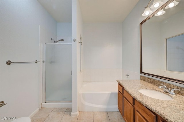 1701 King James St Unit 101, Las Vegas, NV 89144 - full bathroom featuring a shower stall, vanity, tile patterned floors, and a bath