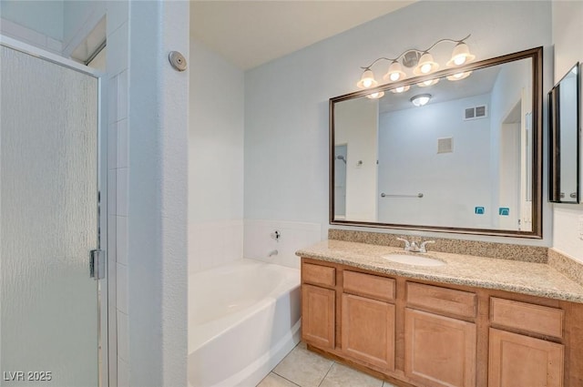 1701 King James St Unit 101, Las Vegas, NV 89144 - full bath with vanity, a shower stall, a garden tub, and tile patterned flooring