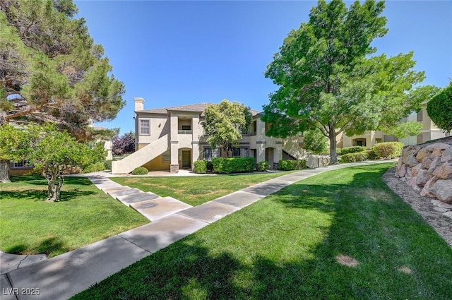1701 King James St Unit 101, Las Vegas, NV 89144 - view of community featuring a lawn and stairs