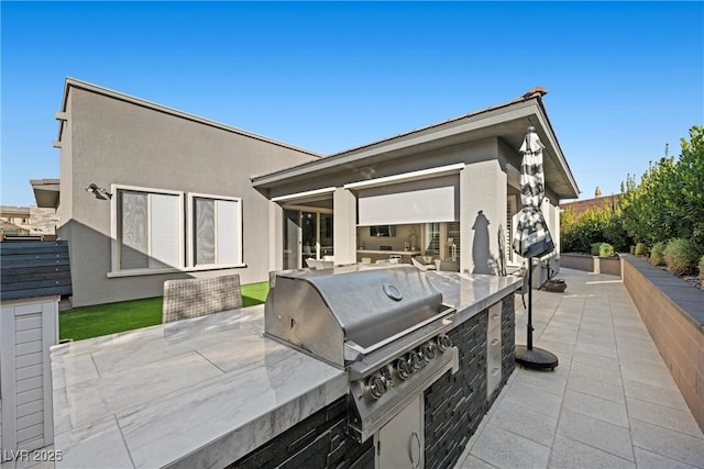 view of patio / terrace featuring a grill and area for grilling