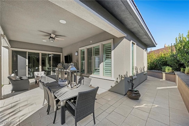 view of patio / terrace featuring ceiling fan