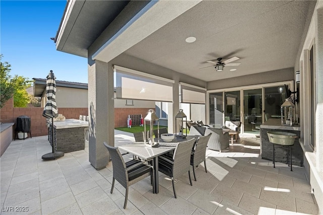 view of patio featuring ceiling fan