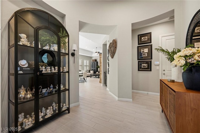 hall with light hardwood / wood-style flooring