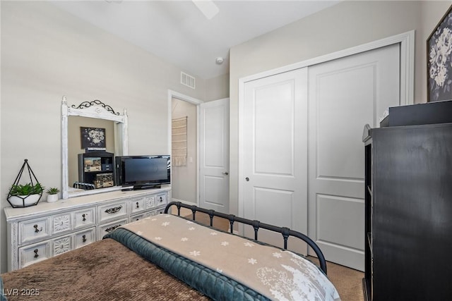 bedroom with carpet flooring and a closet