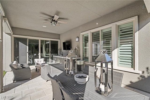 view of patio with ceiling fan