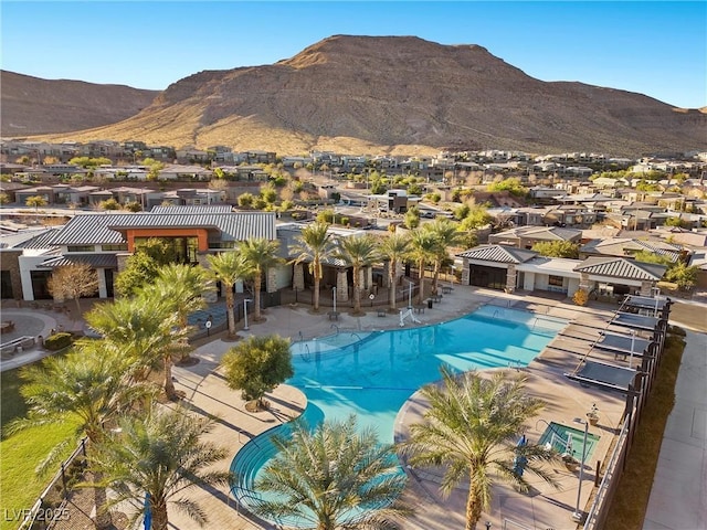 view of swimming pool featuring a mountain view