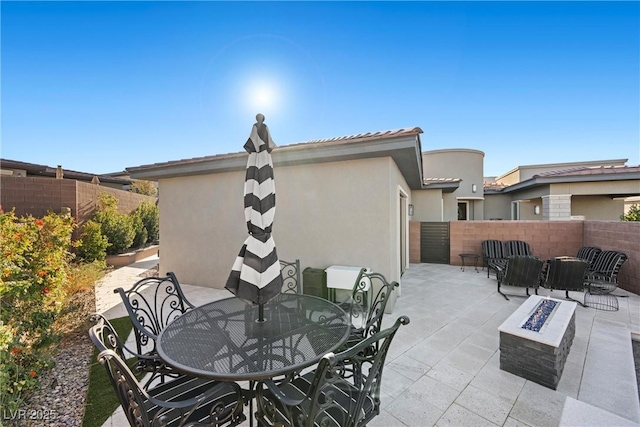 view of patio / terrace with a fire pit