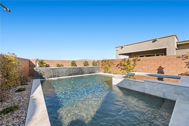 view of swimming pool featuring pool water feature