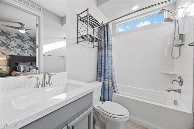 full bathroom with vanity, ceiling fan, toilet, and shower / bathtub combination with curtain