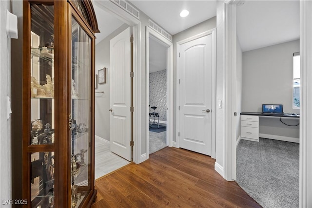 corridor featuring hardwood / wood-style flooring