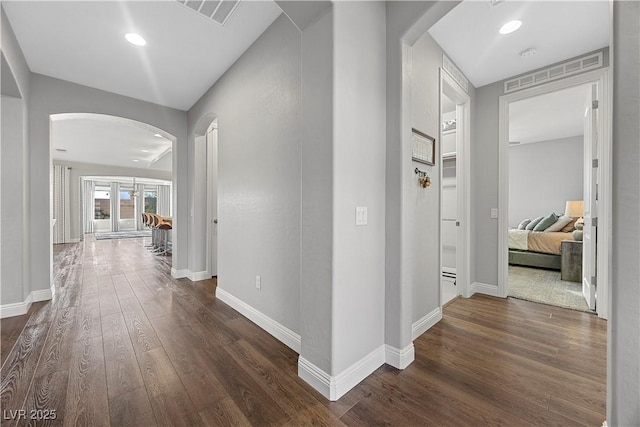 hall with dark hardwood / wood-style floors