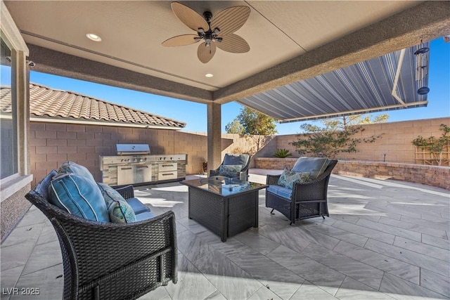 view of patio / terrace featuring ceiling fan, exterior kitchen, an outdoor hangout area, and grilling area