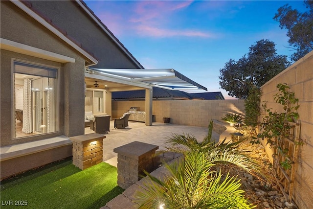 patio terrace at dusk featuring outdoor lounge area