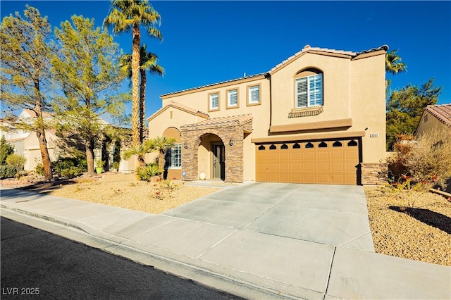 mediterranean / spanish house featuring a garage