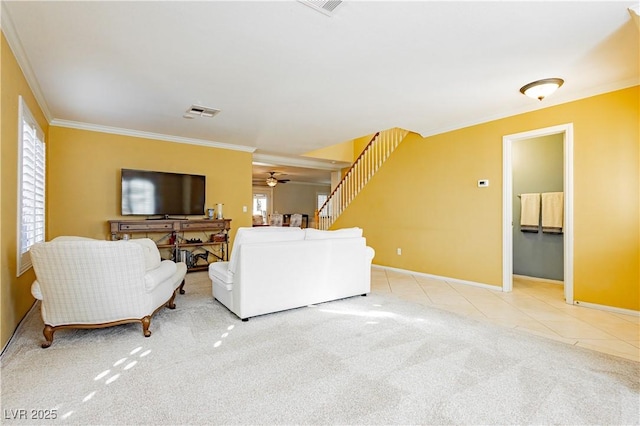 living room featuring ceiling fan, plenty of natural light, carpet, and ornamental molding