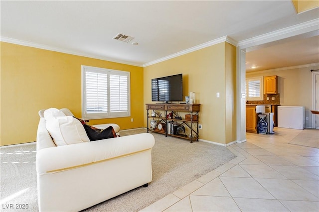 living room featuring ornamental molding and light tile patterned flooring