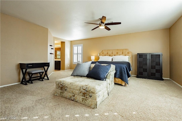 carpeted bedroom featuring ceiling fan and connected bathroom