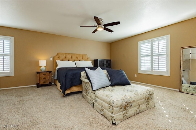 bedroom with multiple windows and ceiling fan