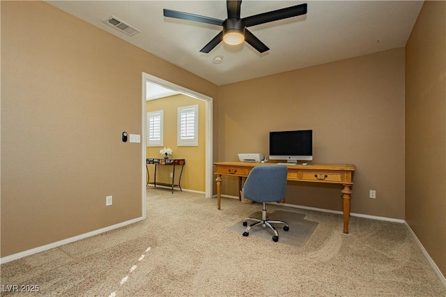 office with light carpet and ceiling fan