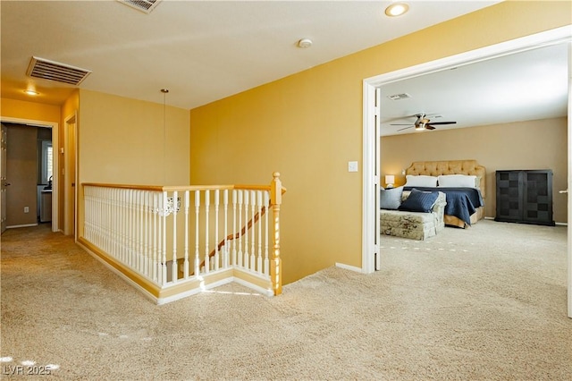 hallway with carpet floors