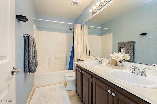 full bathroom with tile patterned floors, shower / bath combo, toilet, and vanity