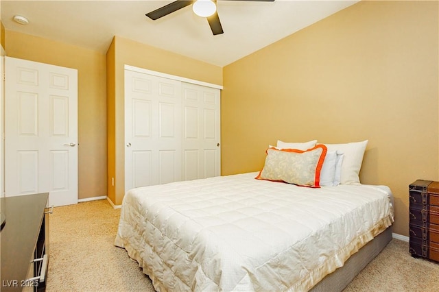 bedroom with ceiling fan, a closet, and carpet