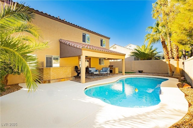 view of swimming pool featuring an outdoor living space and a patio