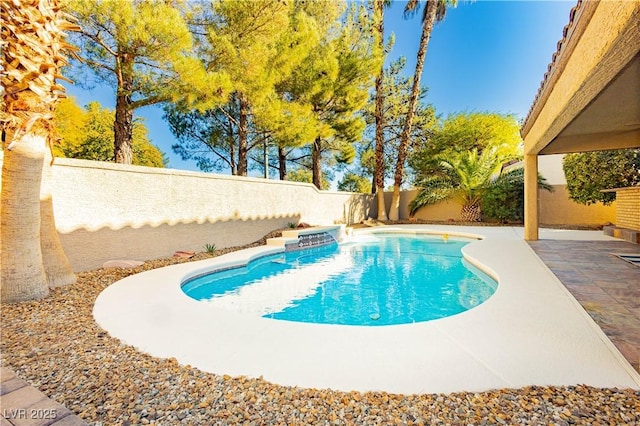 view of swimming pool with a patio area