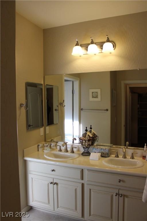 bathroom with vanity and tile patterned floors